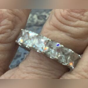 Size 9 7.6 CTW diamond simulant . Rhodium over sterling eternity band